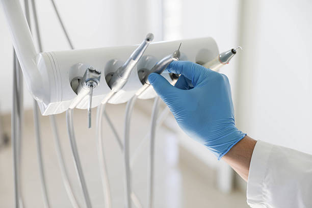 Professional Tooth Extraction technician working in Woburn, MA